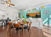 Thumbnail 21 of 51 - Open dining area with kitchen bar seating at The Palms Apartments, Charleston, SC 29407