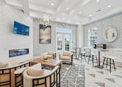 Thumbnail 3 of 28 - A modern living room with a fireplace and a flat screen TV.at The Parker Leland, Leland North Carolina  