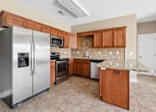 Thumbnail 30 of 39 - Kitchen with stainless appliances and granite counters at The Lory of Greenway Village Apartments, Kentucky, 42001