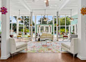 Thumbnail 17 of 51 - Bright clubhouse lobby with floor to ceiling windows at The Palms Apartments, South Carolina