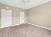 Thumbnail 36 of 39 - A room with beige walls and carpeted floor with a ceiling fan. at The Lory of Greenway Village Apartments, Ky