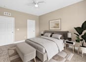 Thumbnail 10 of 39 - A bedroom with a large bed and a ceiling fan. at The Lory of Greenway Village Apartments, Ky