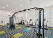 Thumbnail 6 of 28 - A gym with a variety of equipment including treadmills and weight machines.at The Parker Leland, North Carolina, 28451 