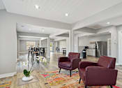 Thumbnail 6 of 26 - Community living room and kitchen at Emerald Bay, North Carolina