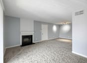Thumbnail 12 of 15 - Living room with a fireplace and white carpet  at Governors House, Alabama, 35805