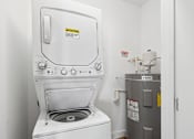 Thumbnail 33 of 39 - A washing machine with a caution sign on it. at The Lory of Greenway Village Apartments, Kentucky