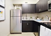 Thumbnail 11 of 23 - Kitchen with appliances at 500 Fifth Apartments, Tennessee