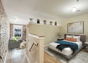 Thumbnail 3 of 50 - the master bedroom has a large bed and a living room with a couch
