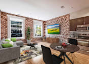 Thumbnail 1 of 50 - a living room with a couch and a table