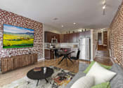 Thumbnail 2 of 50 - a living room with a couch and a table