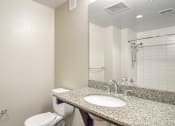 Thumbnail 27 of 50 - a bathroom with a sink and a toilet