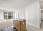 Thumbnail 16 of 64 - A kitchen area with a counter and cabinets.