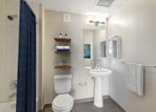 Thumbnail 15 of 50 - a bathroom with a toilet sink and mirror and a shower