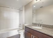 Thumbnail 19 of 50 - a bathroom with a sink and a toilet and a bath tub
