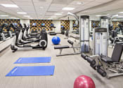 Thumbnail 35 of 50 - a gym with cardio equipment and weights in the new yorker hotel fitness center