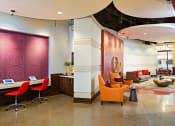 Thumbnail 40 of 50 - the lobby of a hotel with chairs and a reception desk