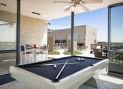 Thumbnail 47 of 50 - a pool table in the patio of a home with a roof terrace