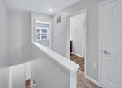 Thumbnail 9 of 25 - a bedroom with a medium sized bed and a window in a house