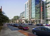 Thumbnail 48 of 50 - a view of a city street with cars and buildings