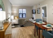 Thumbnail 32 of 50 - a living room and dining room in an apartment