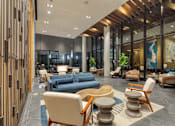 Thumbnail 9 of 37 - the lobby of a hotel with couches and chairs