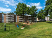 Thumbnail 21 of 23 - a dog park in front of an apartment building