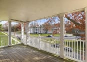 Thumbnail 9 of 23 - a porch with a view of a parking lot