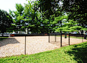 Thumbnail 14 of 17 - A chain link fence surrounds a playground.