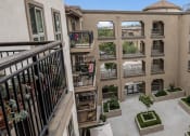 Thumbnail 4 of 6 - an aerial view of the courtyard of a building with potted plants at Casa Salazar apartments