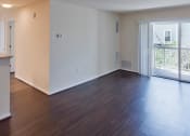 Thumbnail 7 of 12 - an empty living room with a balcony