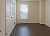 Thumbnail 12 of 12 - an empty room with a door and a window