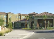 Thumbnail 4 of 6 - a senior apartment building with palm trees in front of it