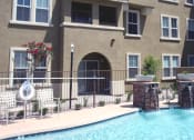 Thumbnail 3 of 6 - a swimming pool in front of an apartment building