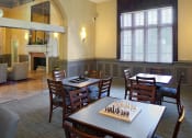 Thumbnail 2 of 6 - Valentine Apartments clubhouse with tables and chairs and a chess board