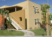 Thumbnail 3 of 6 - a building with a staircase and palm trees in front of it at Vista Sunrise Apartments