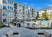 Thumbnail 9 of 16 - Poolside Lounge Area at The Beacon at Waugh Chapel, Maryland