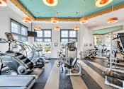 Thumbnail 13 of 16 - Health club with Precor treadmills, ellipticals, stair climber, strength and circuit-training equipment at The Beacon at Waugh Chapel, Maryland