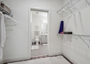 Thumbnail 26 of 40 - a white bathroom with a white rug and a closet at Sinclaire on Seminary, Alexandria Virginia