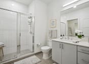 Thumbnail 32 of 40 - a white bathroom with a shower and a sink at Sinclaire on Seminary, Alexandria Virginia