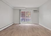 Thumbnail 29 of 37 - Living room of an empty apartment with wood flooring  at the River, Manchester, 03102
