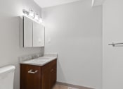 Thumbnail 37 of 37 - Empty bathroom with a sink and a toilet  at the River, Manchester, 03102