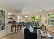 Thumbnail 1 of 20 - the living room and kitchen of an apartment with a couch and a table at Brookstone Village, Cincinnati