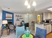 Thumbnail 2 of 20 - a living room and kitchen with a dining room table and chairs at Brookstone Village, Cincinnati
