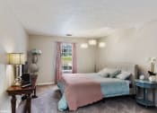 Thumbnail 4 of 20 - a bedroom with a bed and a desk and a window at Brookstone Village, Cincinnati