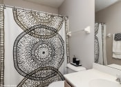 Thumbnail 5 of 20 - a bathroom with a shower and a sink and a toilet at Brookstone Village, Cincinnati