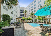Thumbnail 82 of 92 - Pool surrounded with table and chairs at Esplanade at City Park, Louisiana, 70119