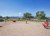 Thumbnail 35 of 44 - A park with a red fire hydrant and a blue car in the background. at Windmill Apartments, Colorado Springs, CO, 80916