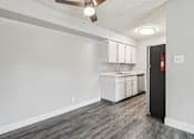 Thumbnail 15 of 45 - A kitchen area with a sink, cabinets, and a ceiling fan at Spyglass Creek, Denver, 80224
