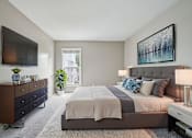 Thumbnail 3 of 40 - Bedroom With TV at Glen at Lakewood, Colorado