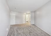 Thumbnail 22 of 57 - A spacious room with carpeted floor and white walls. at Millennium at Creve Coeur, Missouri